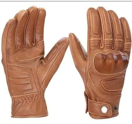 Pair of brown leather gloves on a white background