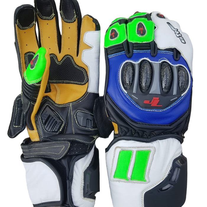 Pair of motorcycle gloves with different color schemes on a concrete surface